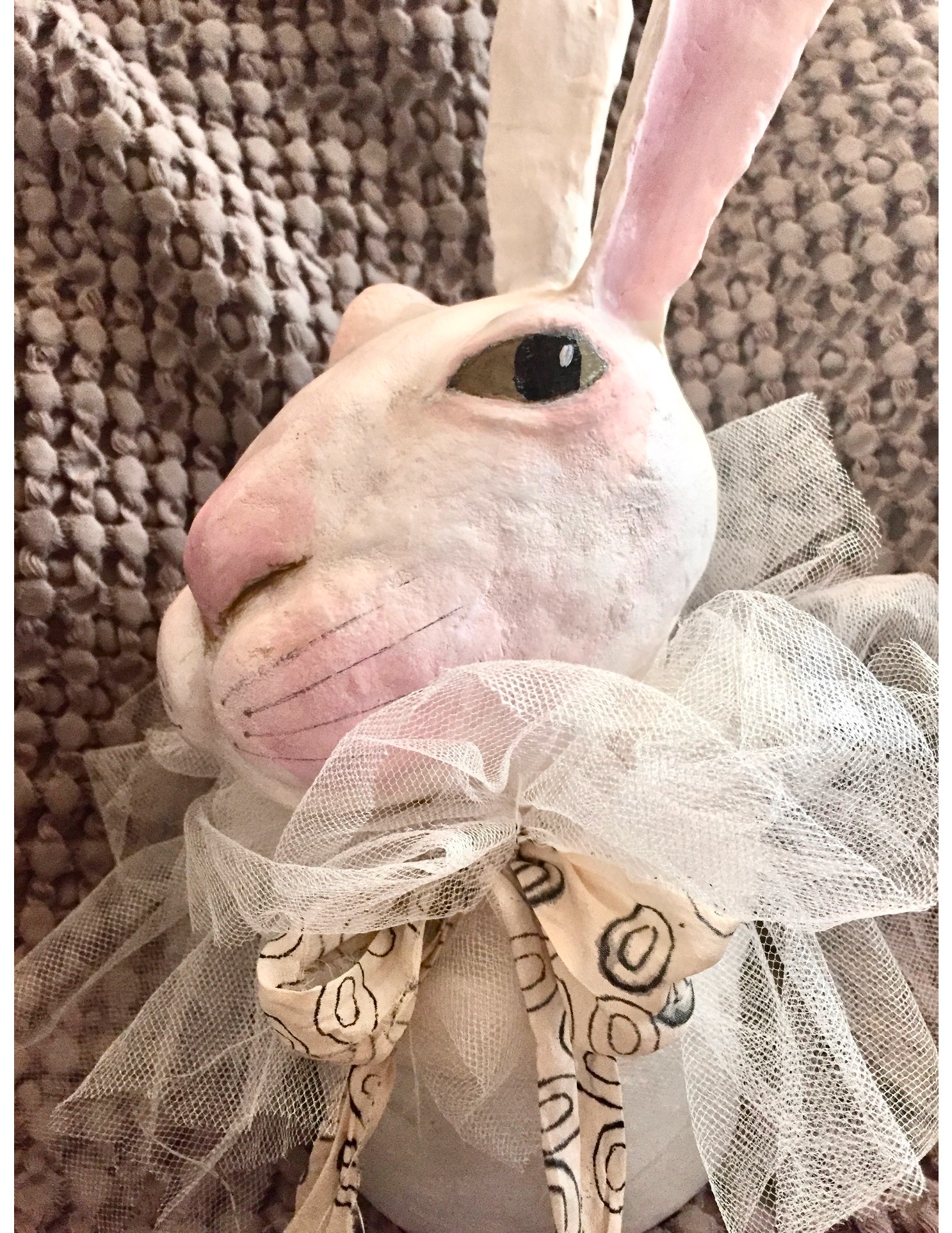 Whimsical paper mache rabbit sculpture with tulle collar